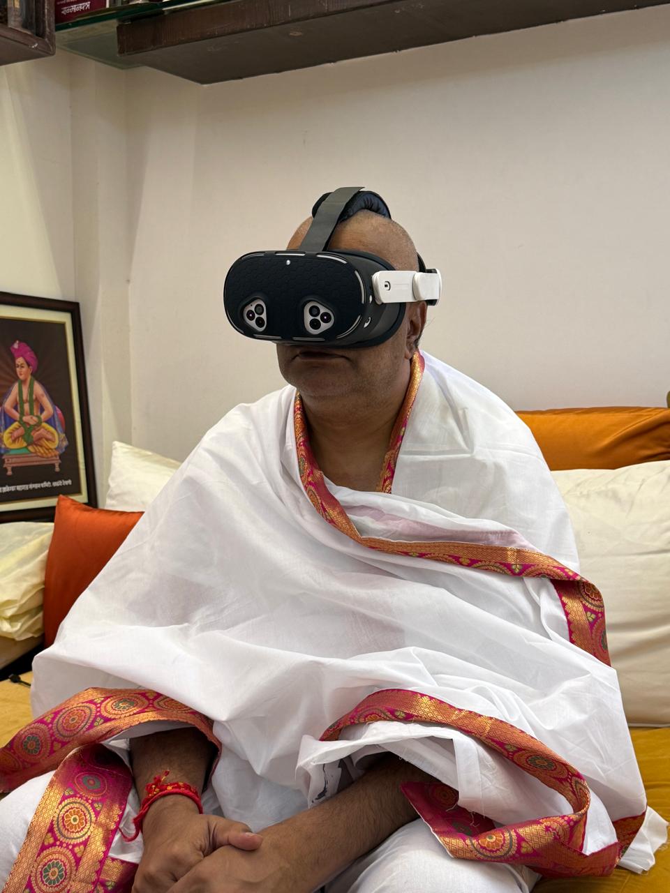 Revered Maharaj experiencing virtual temple darshan